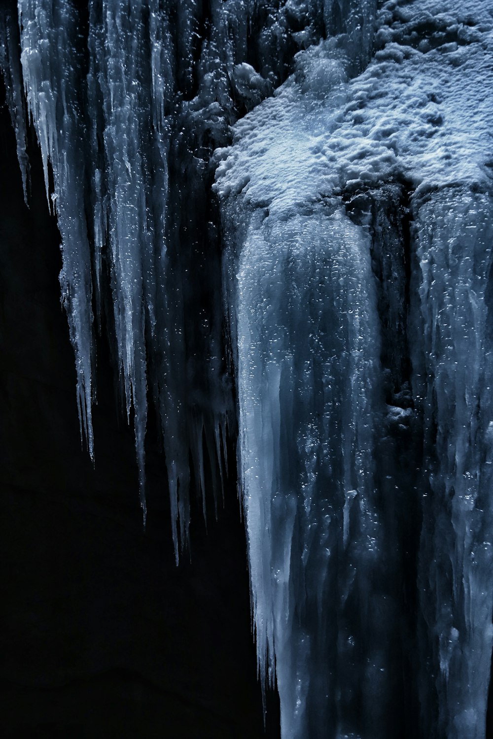 a close up of ice on a black background