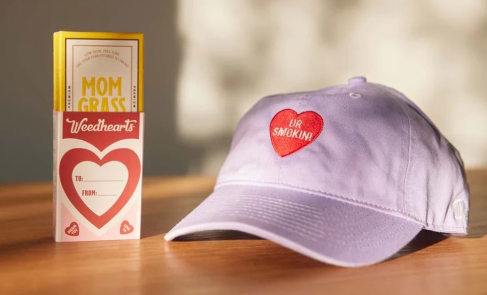 a baseball cap sitting next to a box of cigarettes