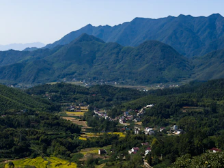 The lush green terraces of the Sacred Valley with traditional Andean villages nestled in the landscape.