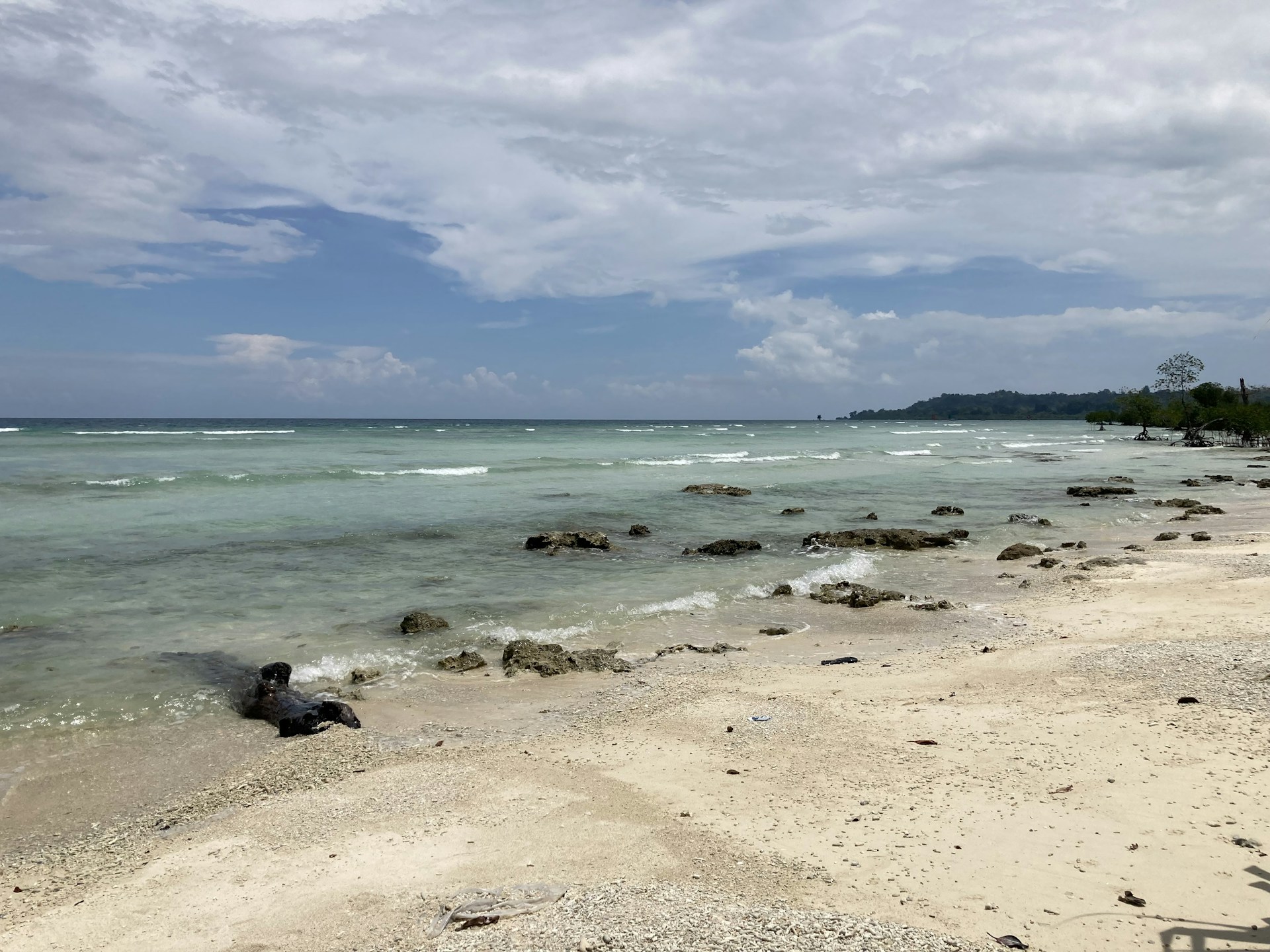woman wearing yellow long-sleeved dress under white clouds and blue sky during daytime