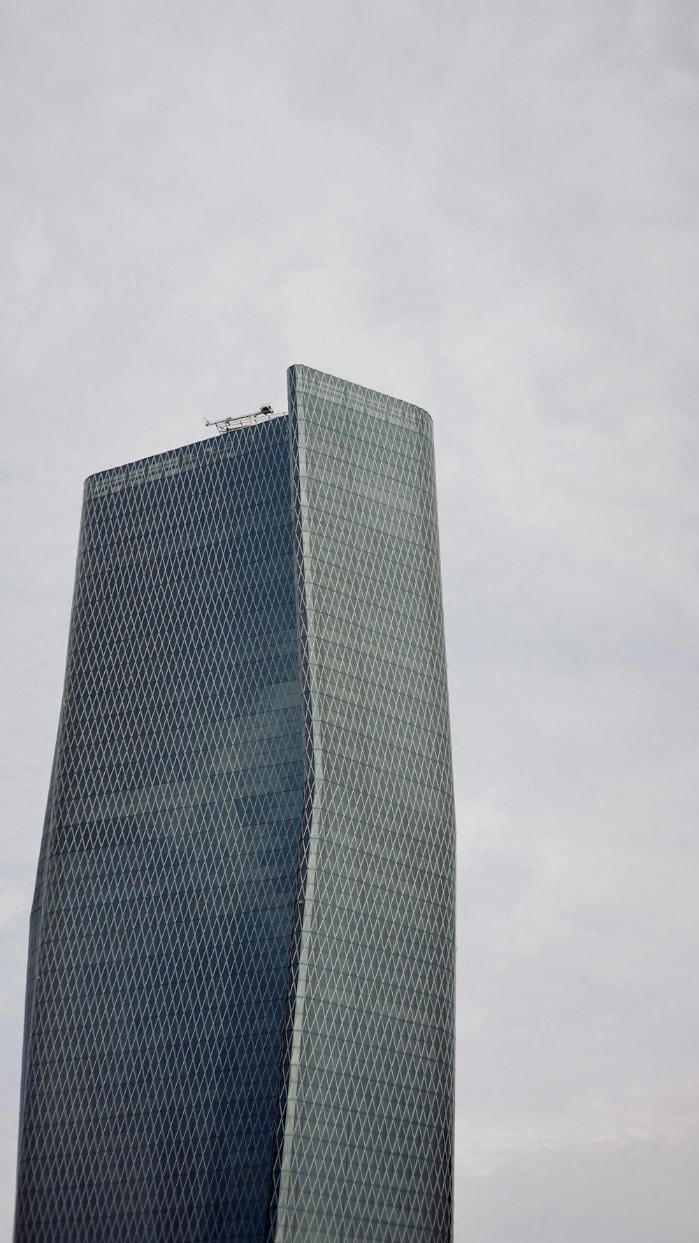 a tall building with a sky background