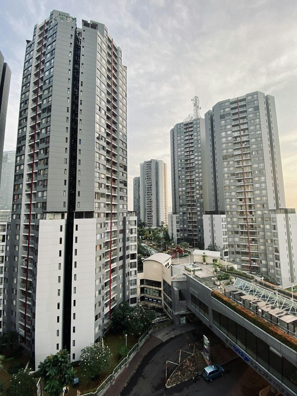 a couple of tall buildings sitting next to each other