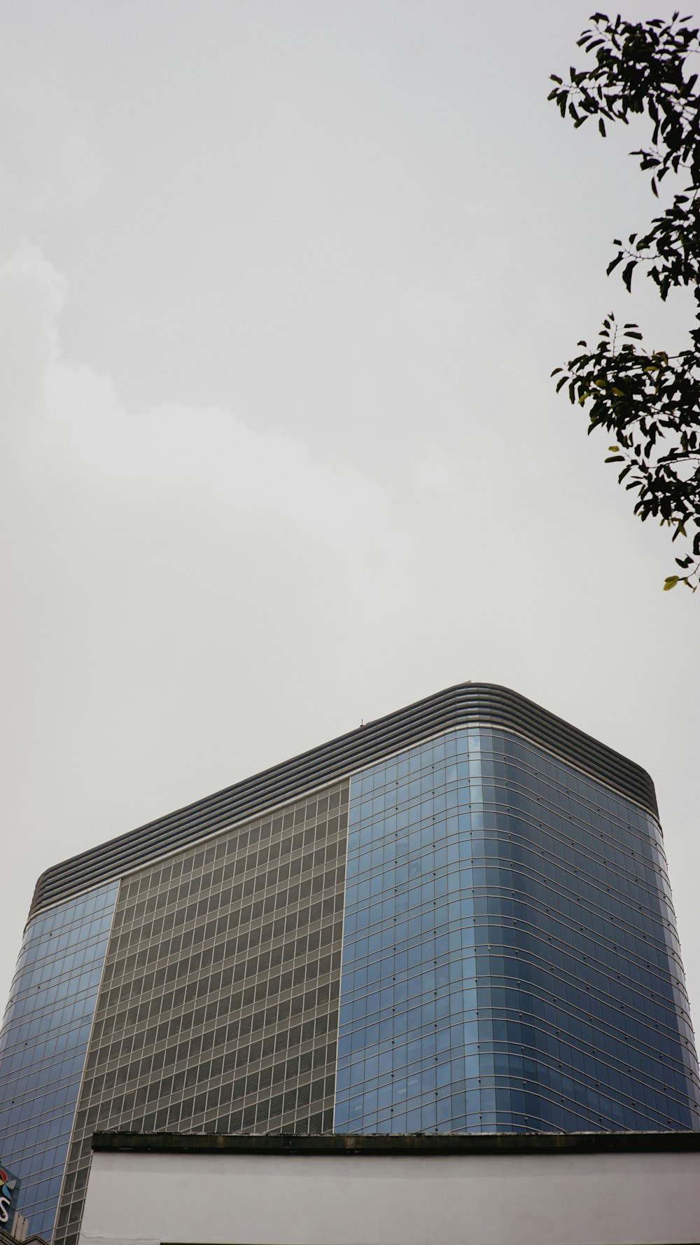 a very tall building with a sky background