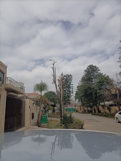 Street view of a quiet residential area with well-maintained rental homes.
