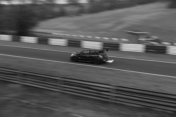 Close-up of a car racing through a checkpoint with sparks flying from the wheels