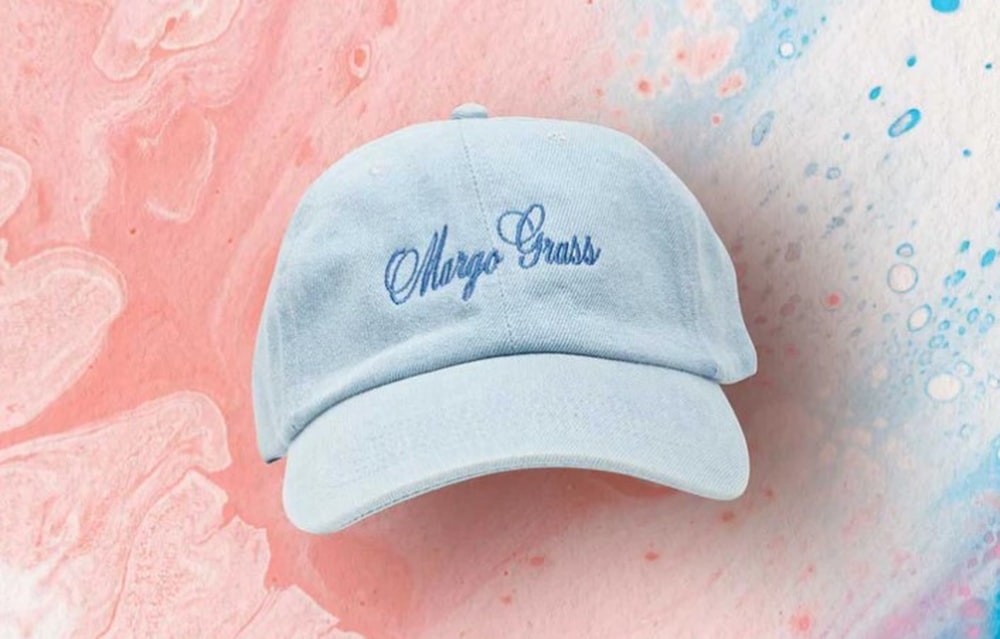 a blue cap with the word cheap brass embroidered on it