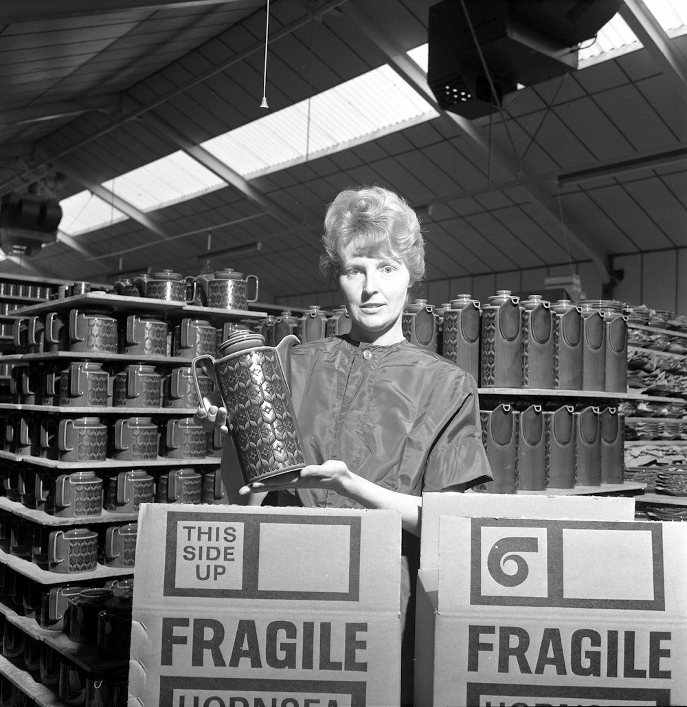 a woman holding a trophy in a store