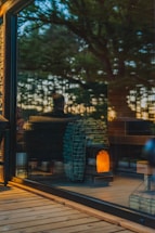 A friendly technician assisting a customer with biomass stove maintenance in a cozy home setting.
