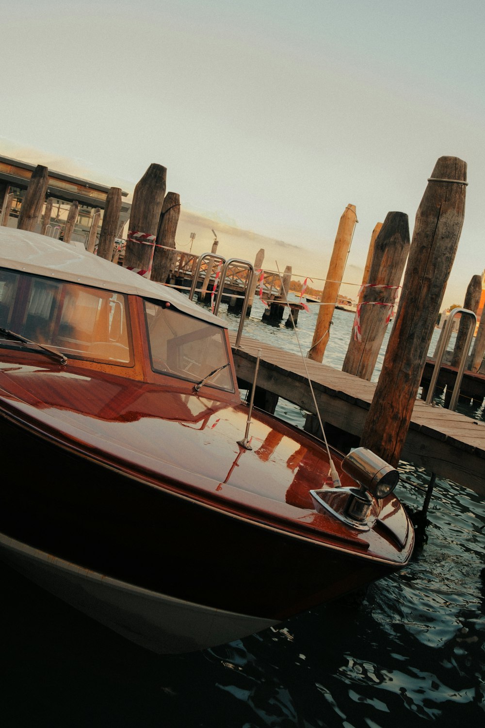 a boat is docked at a pier in the water