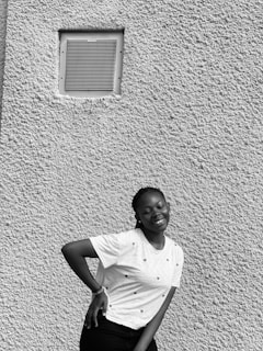 A satisfied homeowner standing next to a freshly cleaned air duct system.