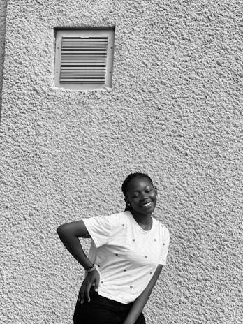 A satisfied homeowner standing next to a freshly cleaned air duct system.