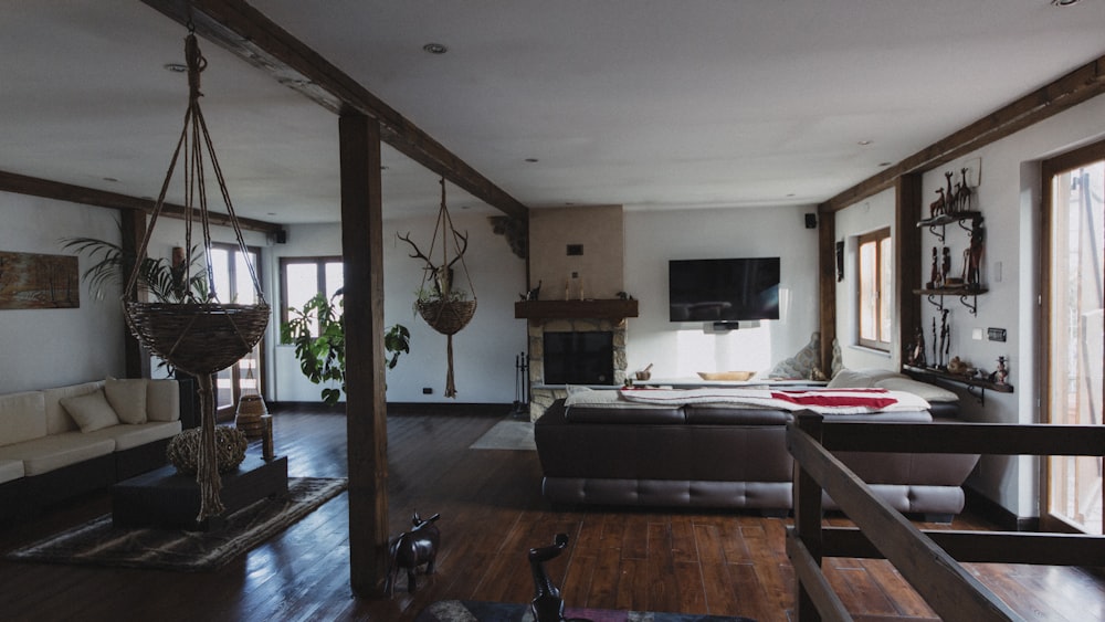 a living room filled with furniture and a fire place