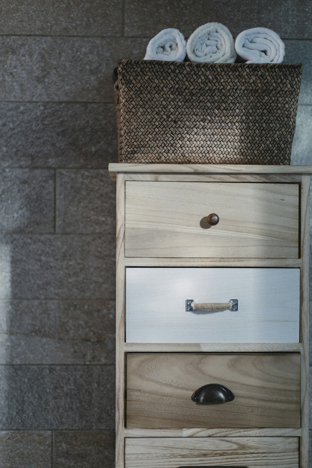 a drawer with towels on top of it