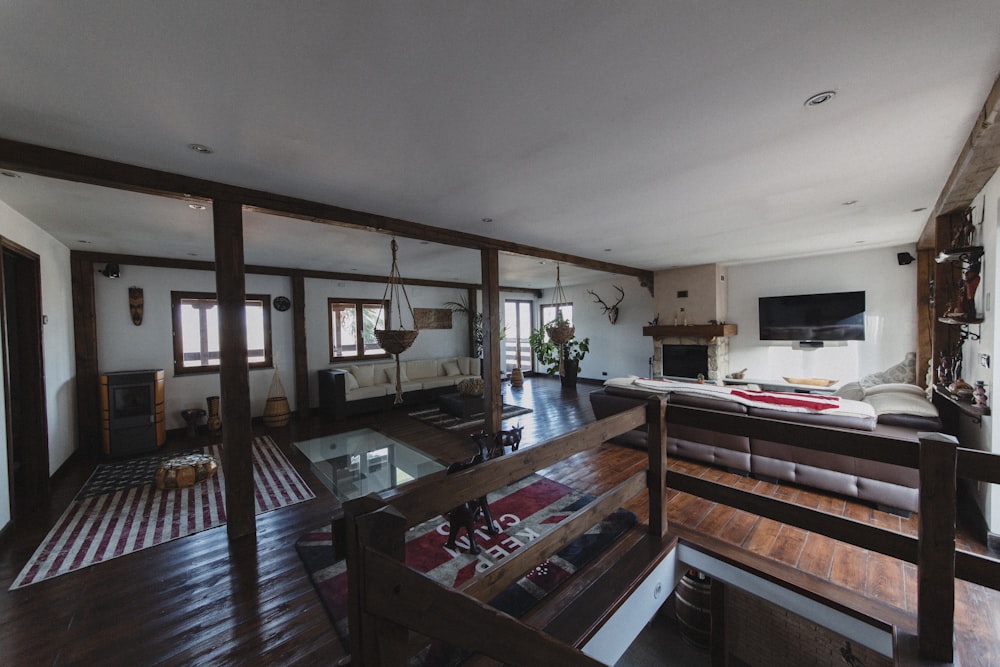 a living room with wood floors and white walls