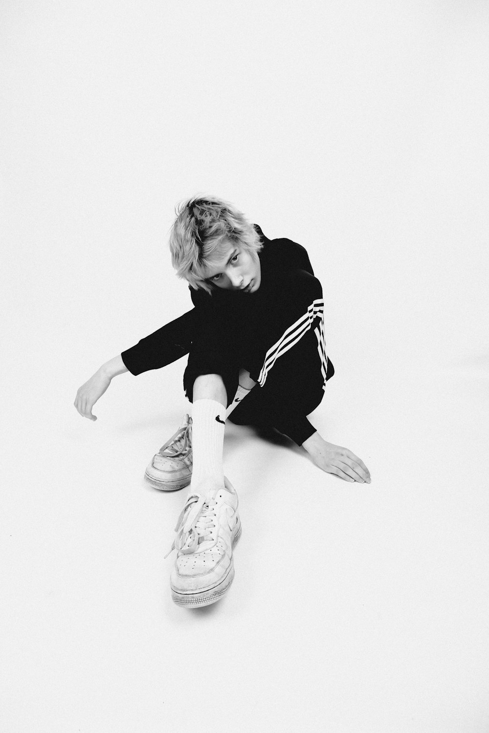 a black and white photo of a child on the ground