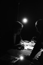 A calm, sunlit room where a mentor and a teenager are engaged in a thoughtful conversation.