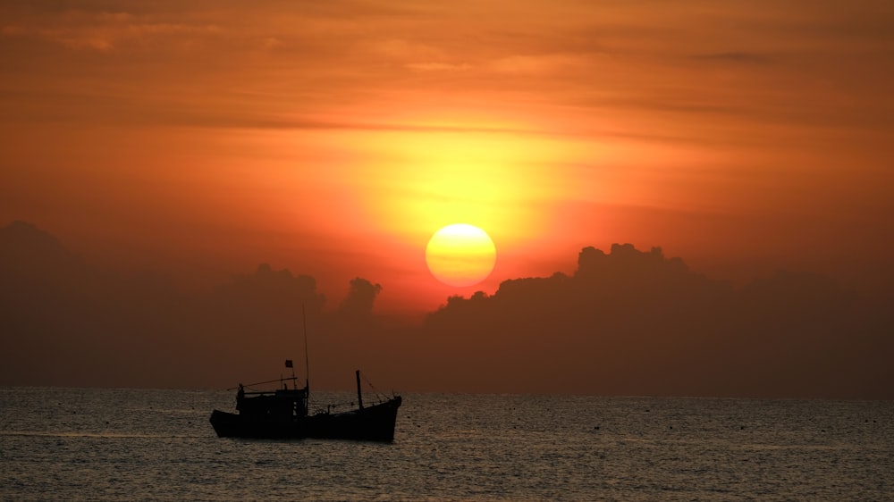 a boat floating on top of a body of water