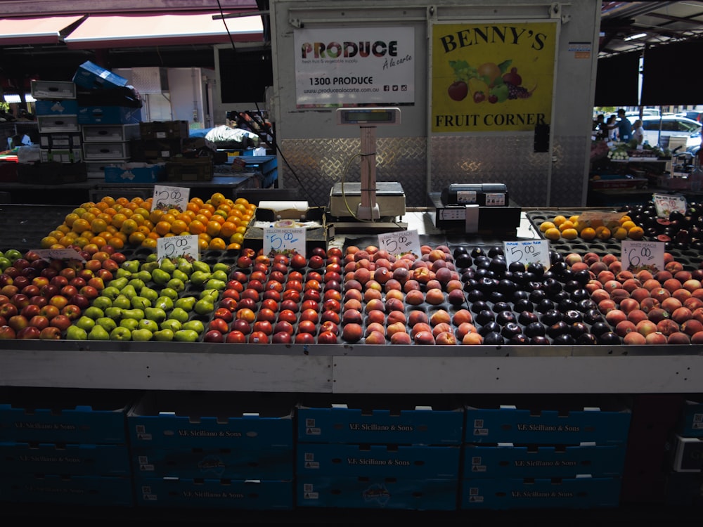 a fruit stand with a variety of fruits for sale