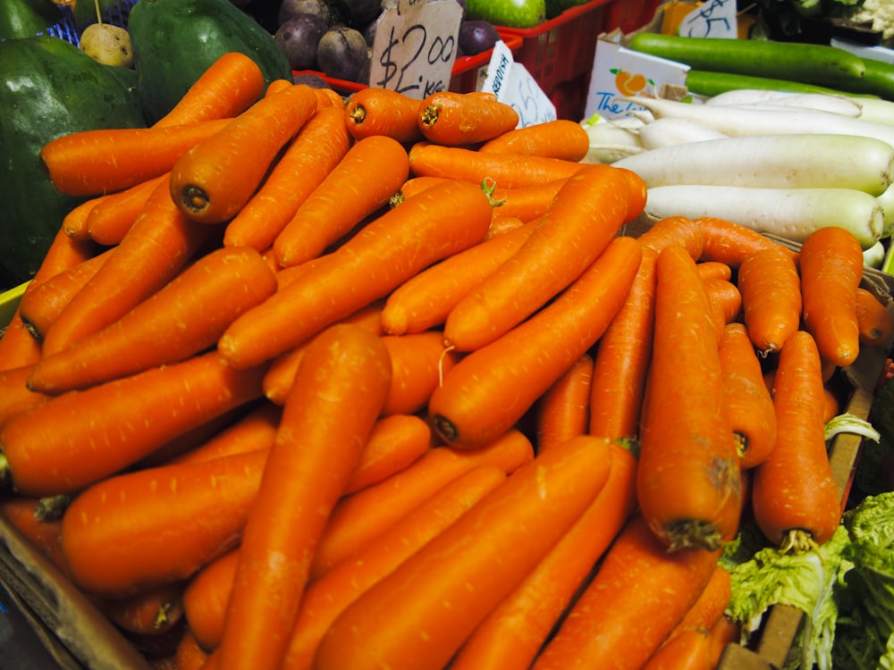 a pile of carrots sitting on top of a table