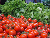 A close-up of fresh fruits and vegetables being packed for distribution.