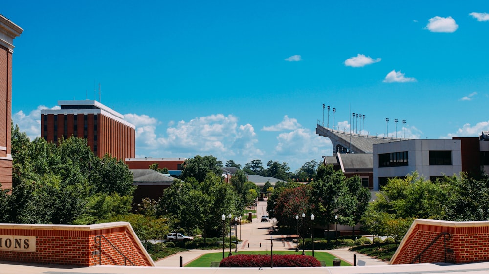 a college campus with a clock tower in the background