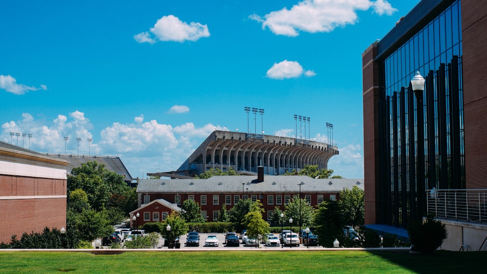 a stadium with cars parked in front of it