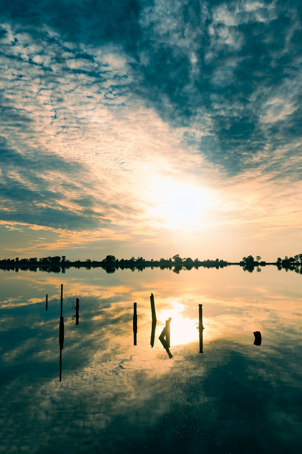 a body of water that has some poles in it