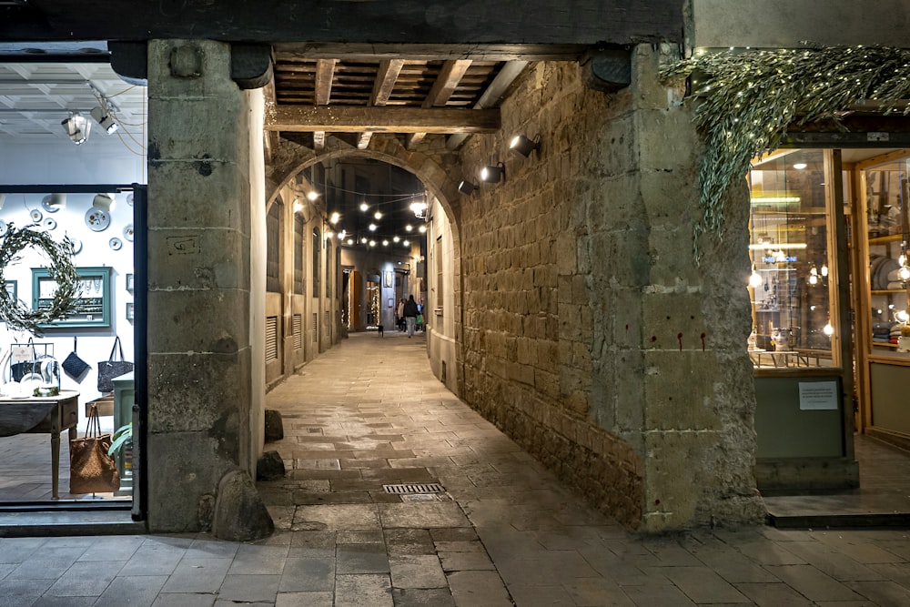 a stone building with a clock on the wall