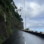 a road with a steep cliff on the side of it