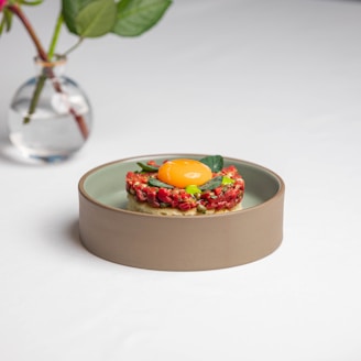 a plate with a piece of food on top of it