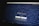 A website homepage displayed on a computer screen featuring a design made up of various letters and symbols, forming an artistic pattern around the central text that reads 'Midjourney'. Below the text, there are navigational options such as 'Join the Beta', 'Sign In', 'Getting Started', and 'Community Showcase'. The background is predominantly dark with white text.