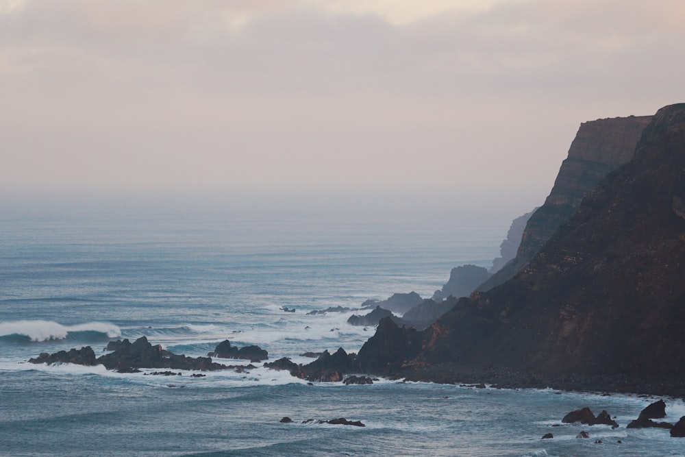 a view of the ocean from a cliff