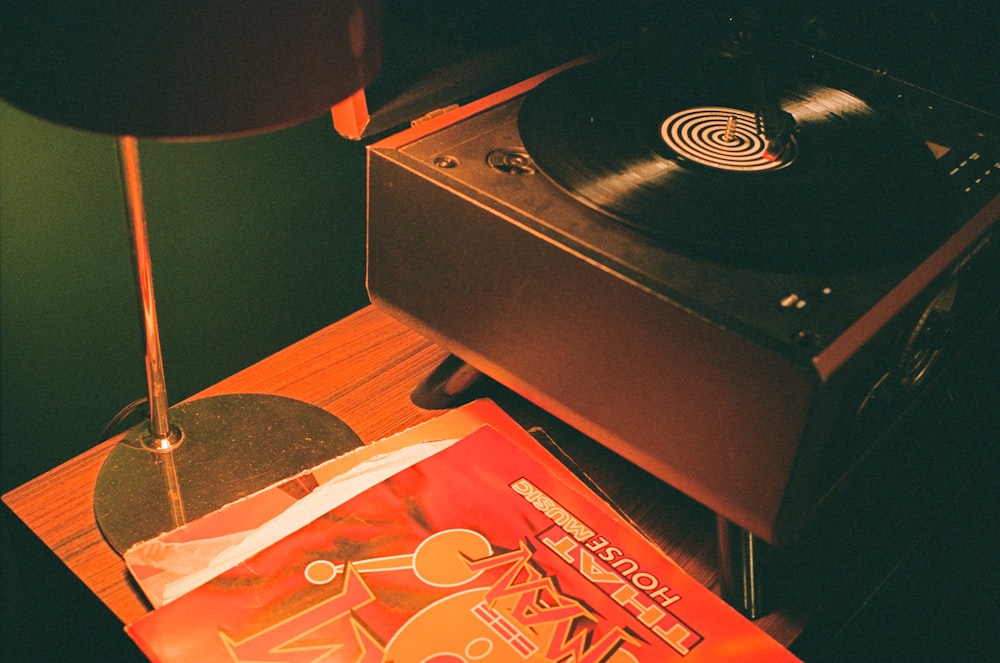 a record player and a book on a table