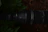 Close-up photo of a rugged reinforced pipe installed in a deep garden well surrounded by soil layers.
