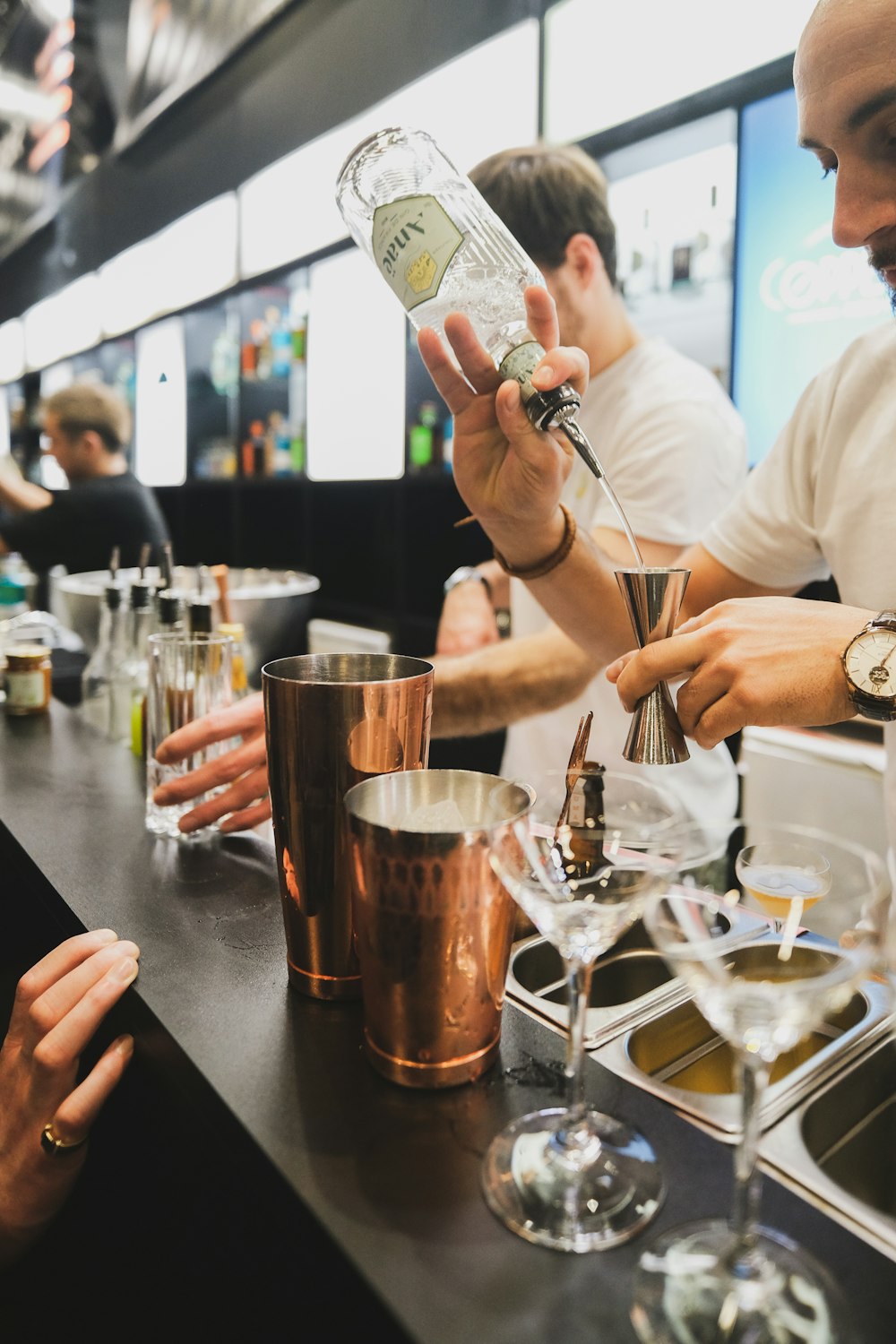 a group of people sitting at a bar