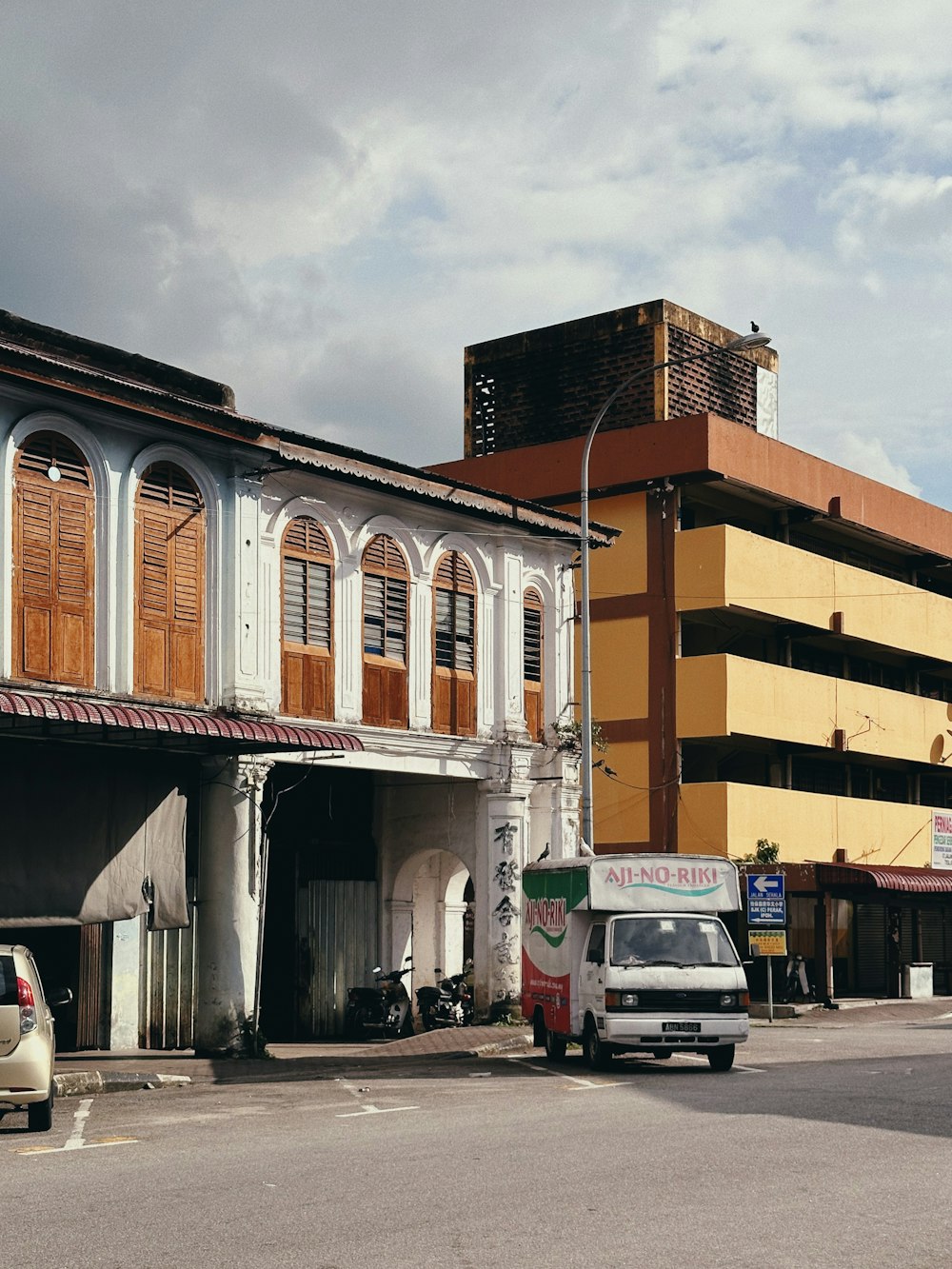 a van is parked in front of a building