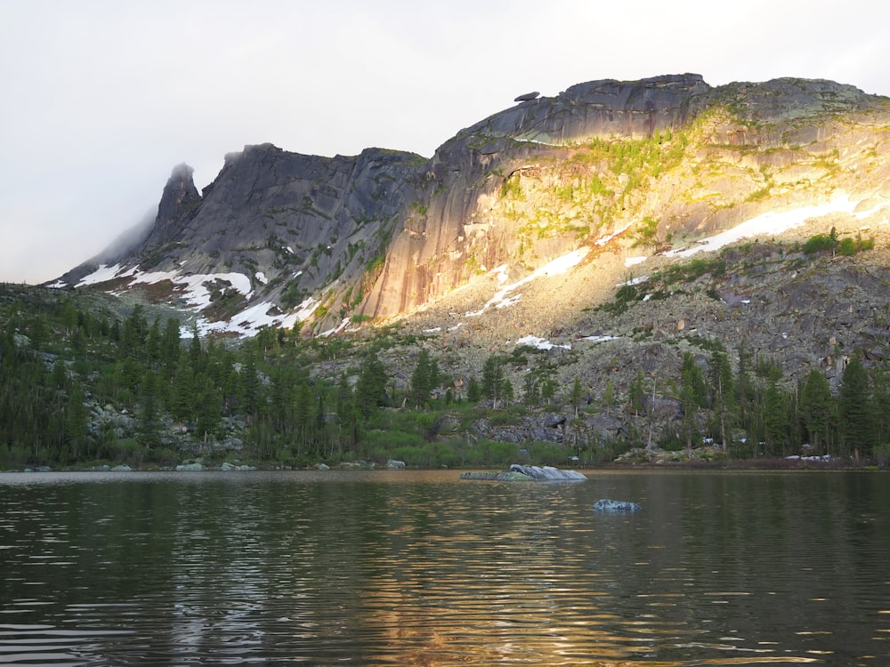 a mountain with a lake in front of it