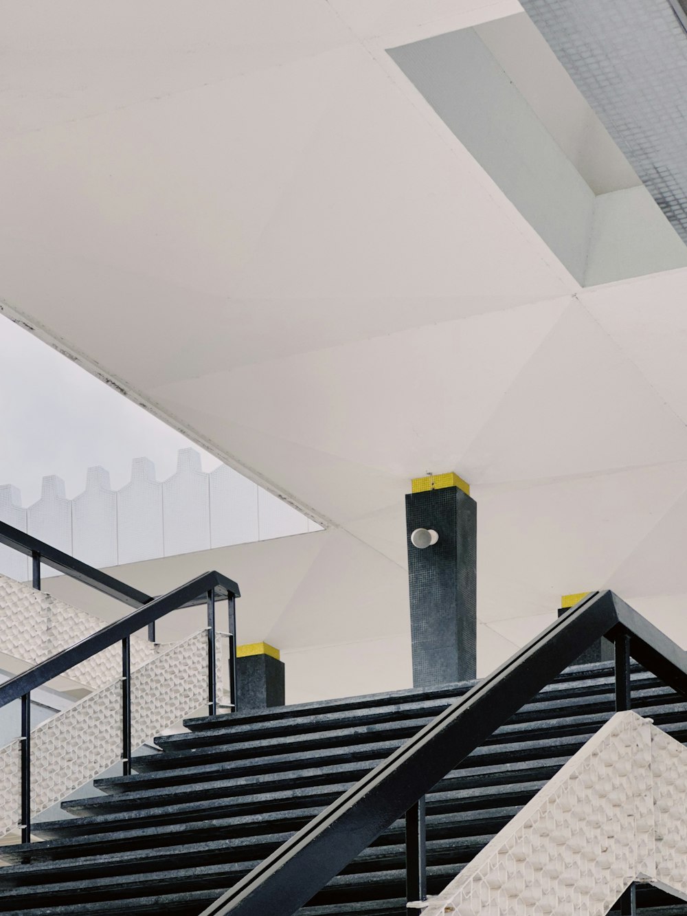 a stair case with a clock on the top of it