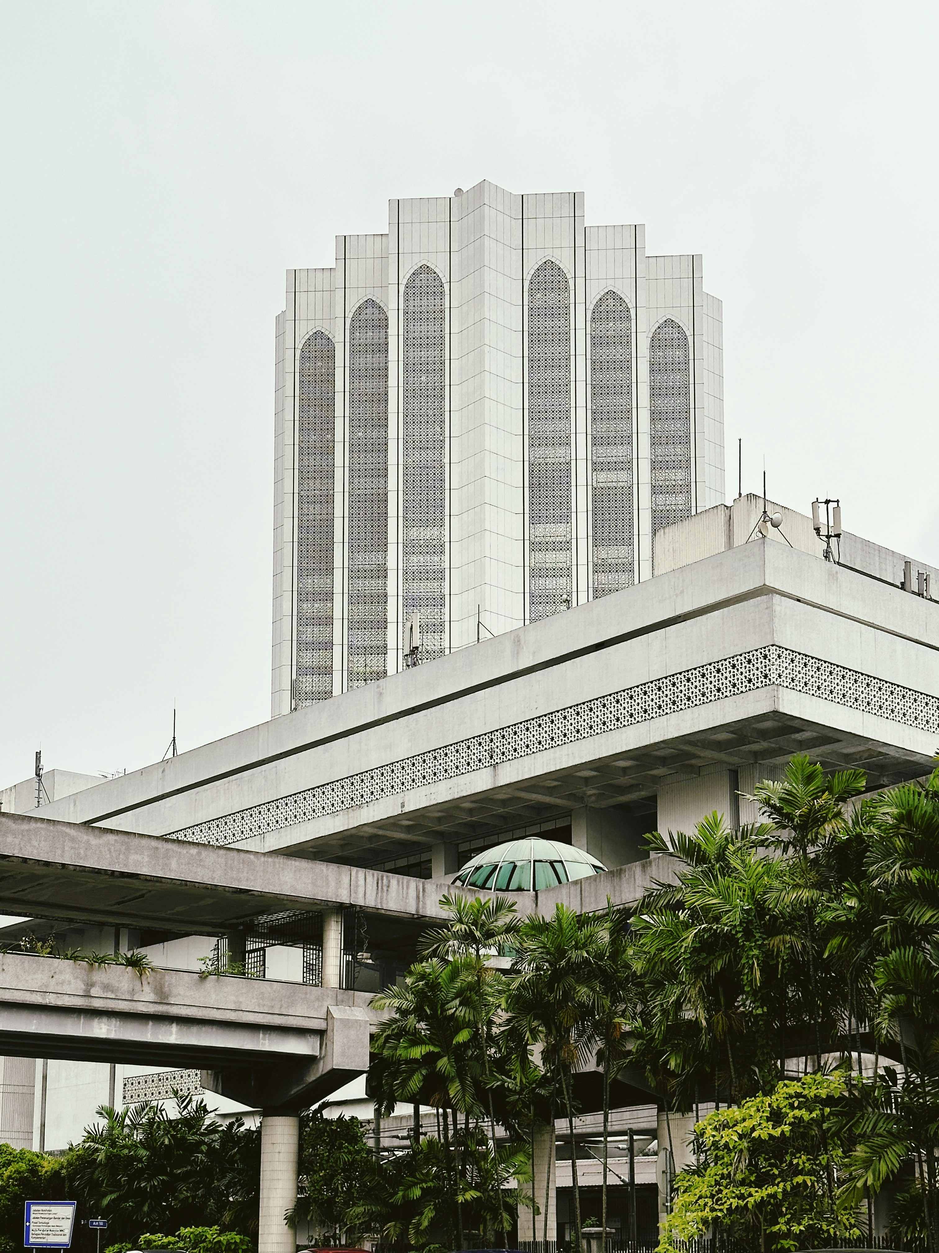 a large building with a green umbrella in front of it