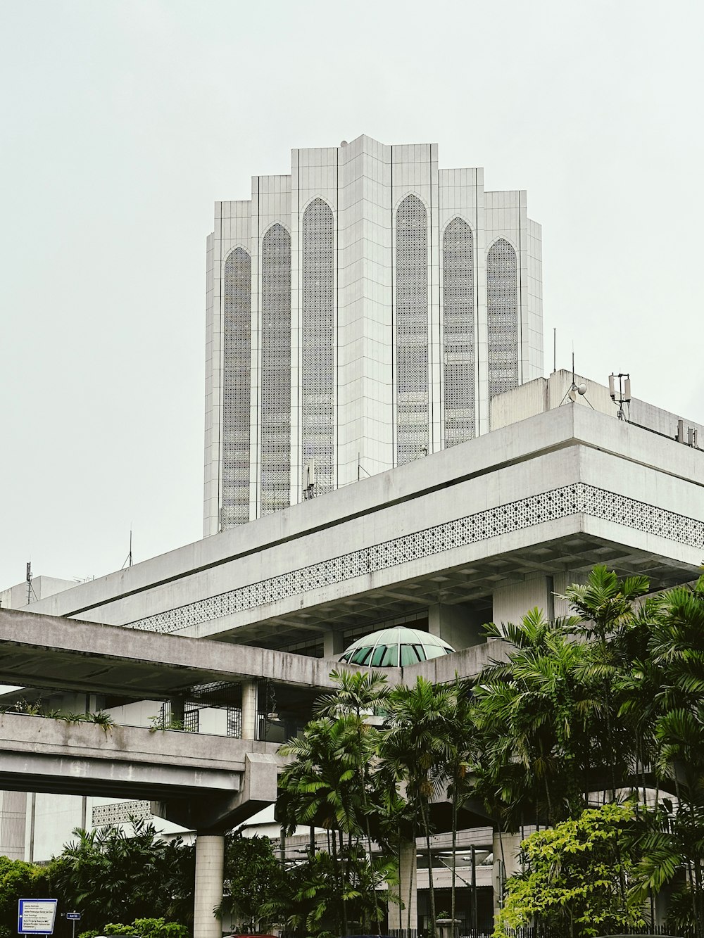 a large building with a green umbrella in front of it