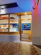 A sleek modern website homepage for a local coffee shop designed with blue and orange accents.