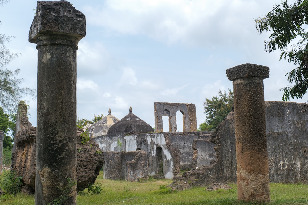 the ruins of an old church in the middle of a field