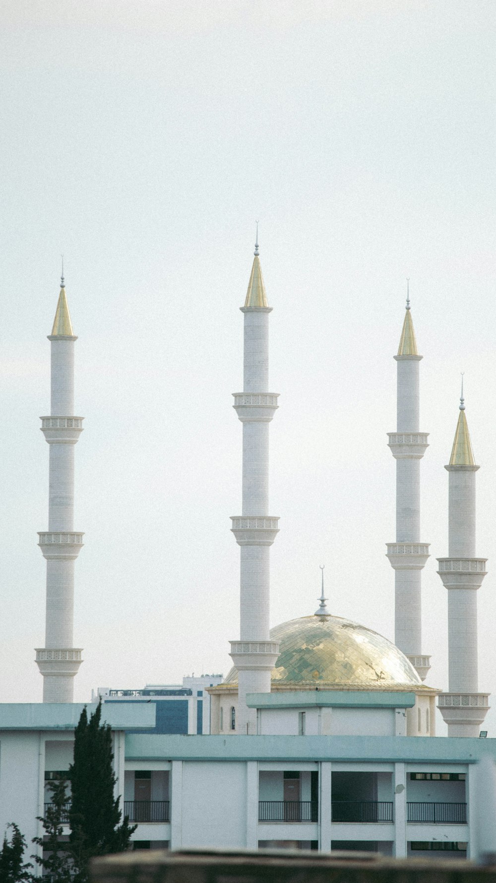 a large white building with a gold dome