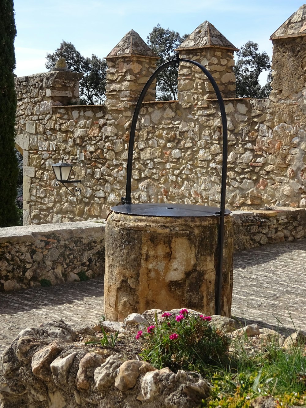 a stone building with a circular iron structure