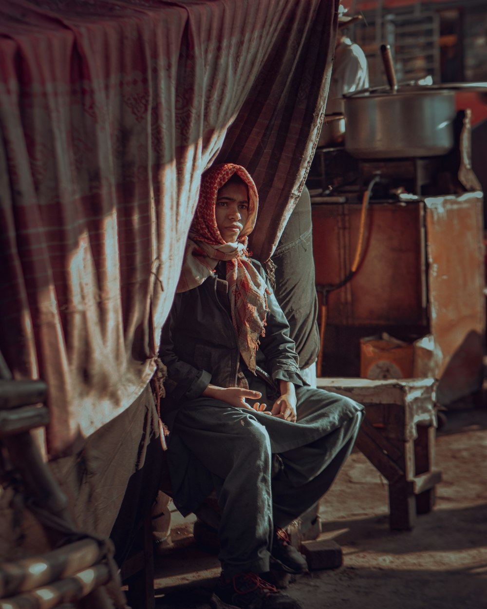 a woman sitting on a bench in a room