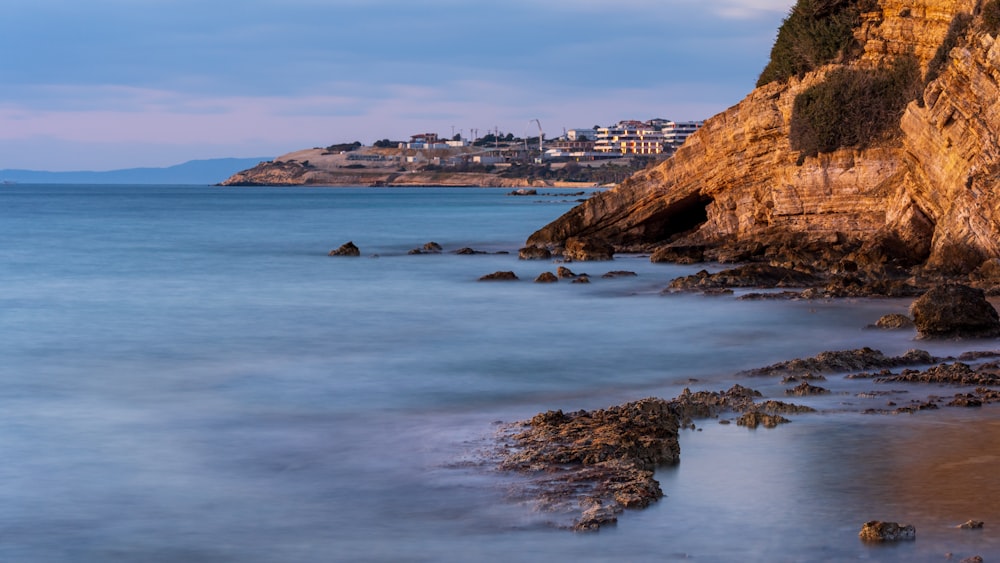 a view of the ocean with a city in the distance