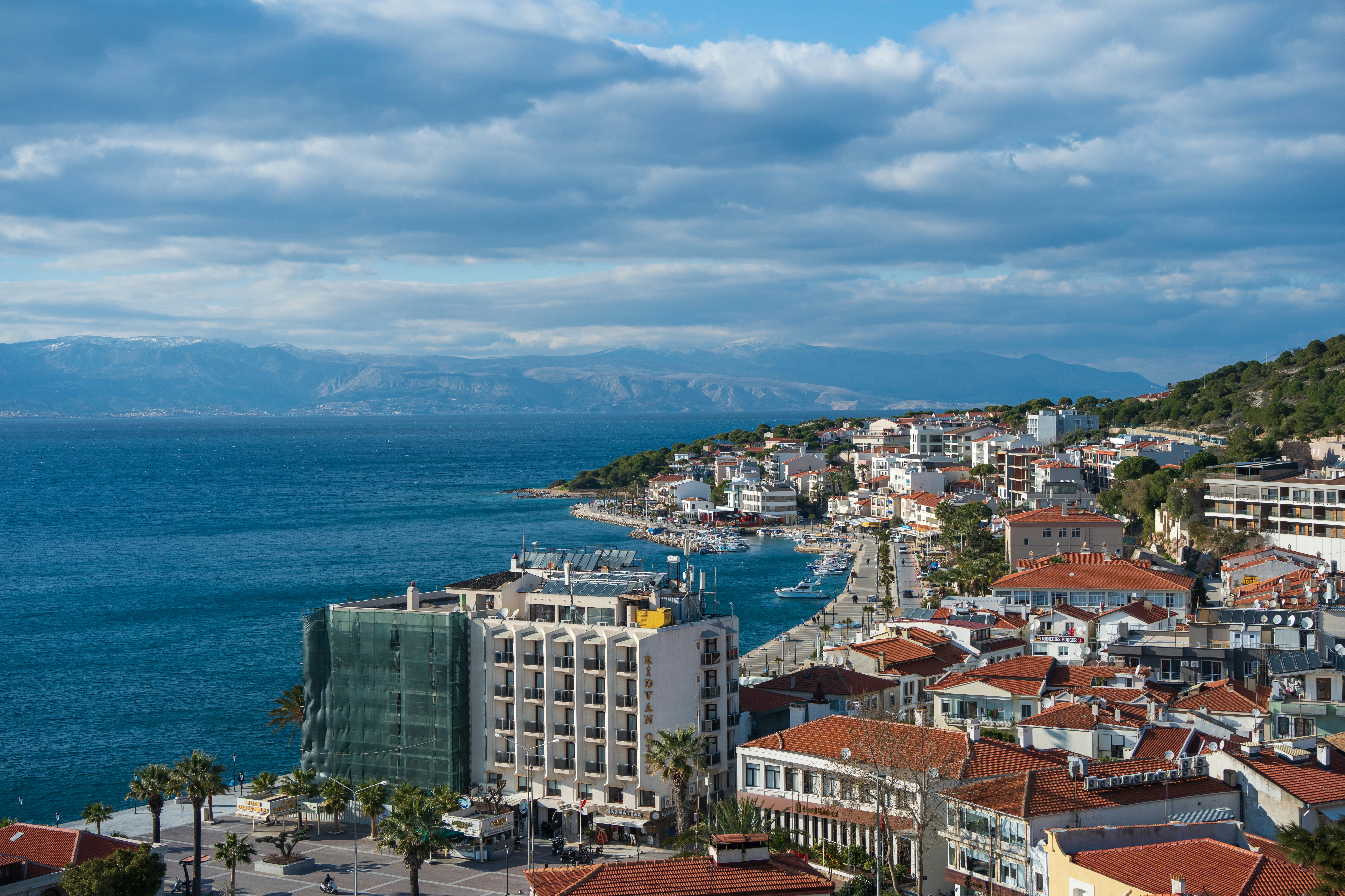 a view of a city next to a body of water, 