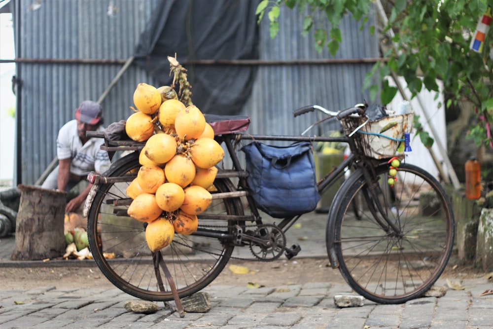 a bicycle with a bunch of oranges on it