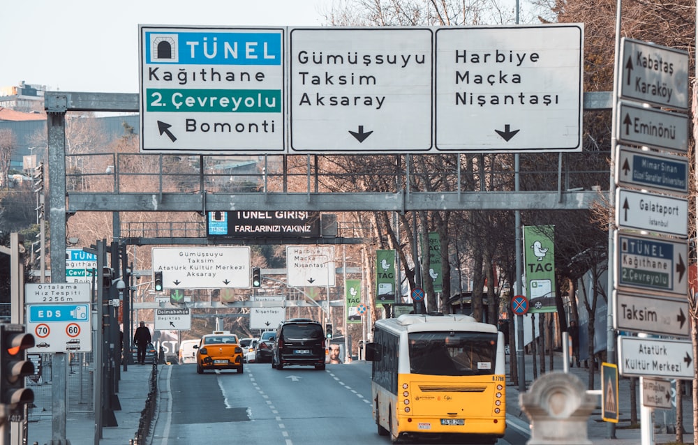 a street filled with lots of traffic next to tall buildings