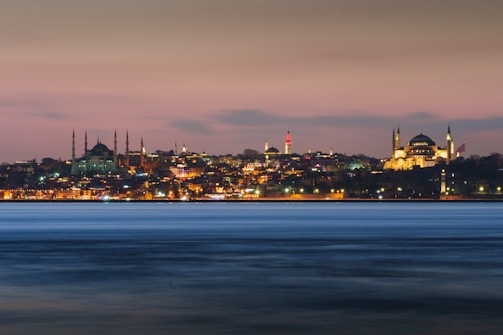 A panoramic view of Istanbul with a courier riding through the iconic Bosphorus Bridge.